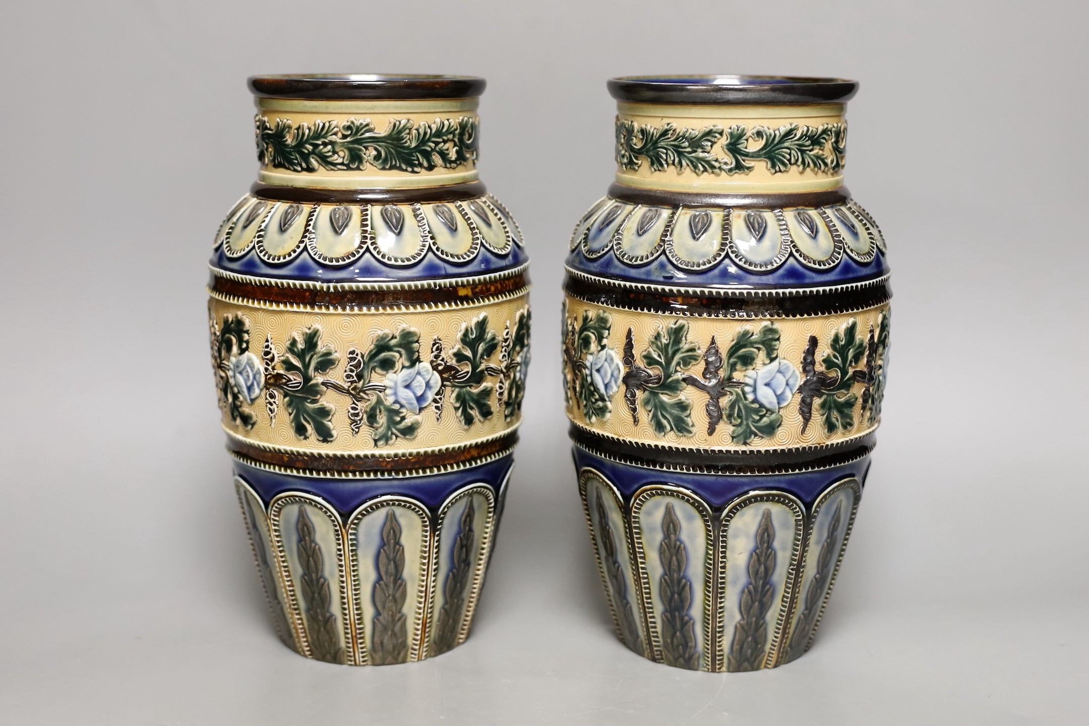 A pair of Doulton Lambeth vases, c.1885, 25.5cms high (a.f.)